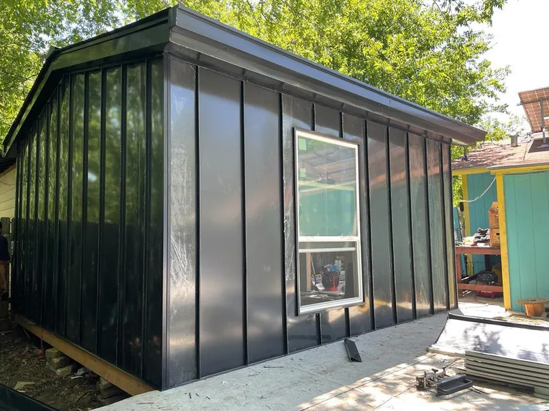 Black standing seam metal wall panels for Metal Roof Installation in Plains